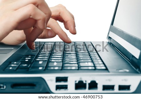 Hands above computer keyboard