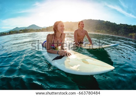 Similar – Image, Stock Photo Surfing couple waiting for the wave