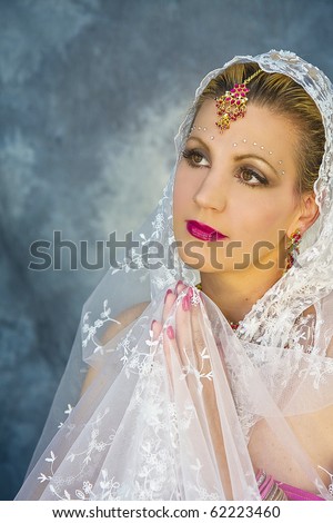 Lady wearing India sari and their ornate beautiful jewelry