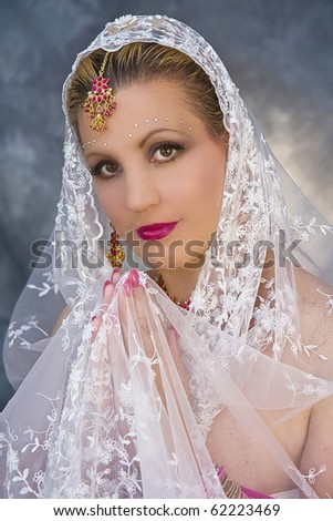 Lady wearing India sari and their ornate beautiful jewelry