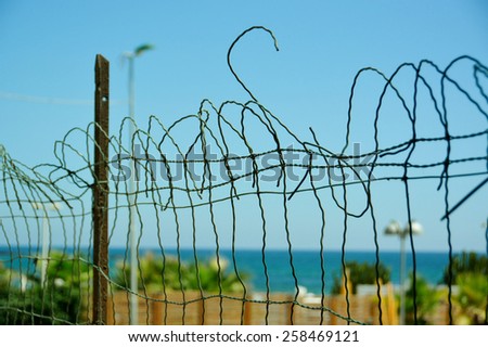 A broken fence represents the freedom.