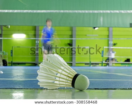 Shuttlecock for badminton on floor when people play badminton in court
