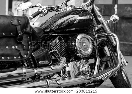 Szeged, Hungary - May 30th, 2015: Photo shoot of Yamaha Drag Star 1100 XVS bike from 2002, closeup shoot of a front wheel,engine and body. 4-stroke SOHC V-twin engine, 1063cc. Black and whte photo.