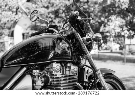 Subotica,Serbia -Jun 13,2015:Photo shoot of Kawasaki ZR 1100 Zephyr A1 bike from 1992,close up shoot of whole bike,exhaust and chrome parts.1062cc.Black and white photo.Selective focus:Kawasaki badge