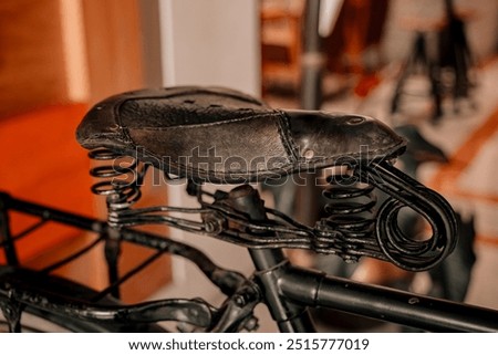 Similar – Image, Stock Photo Old bicycle saddle with visible springs and rust