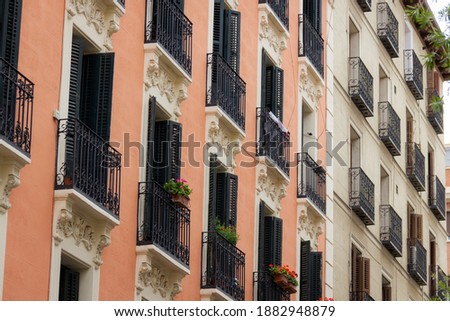 Small balconies residential building facade in Madrid. Real estate business, classic architecture style concepts Foto stock © 