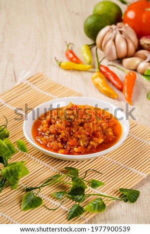 Sambal Bawang Or Spicy Onion Sauce with ingredients, Onion, Red Chilies, garlic, and salt. Sambal Bawang is favorite chili sauce in Indonesia