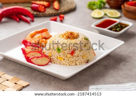 Yangzhou fried rice is a popular Chinese-style wok fried rice dish. Asia Chinese China food cuisine. Authentic Yangzhou fried rice with egg, fresh prawn and Red Roast Pork. Foto d'archivio © 