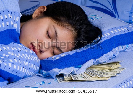woman sleeping with money under her pillow