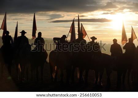 Polish highlanders on their horses with polish flags in the background polish tatra mountains