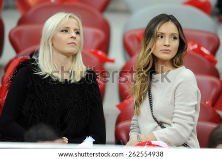 WARSAW, POLAND - OCTOBER 14, 2014: EURO 201 Football Cup Qualifiers Scotland vs Scotland\
o/p: Marina Luczenko Maciej Szczesny girlfriend (on the right )