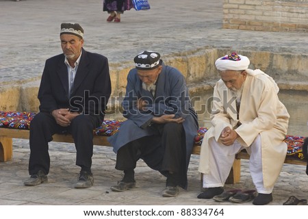 BUKHARA, UZBEKISTAN - OCTOBER 6: Unidentified Muslims pray  to celebrate the Muslim holiday of Eid ul-Fitr on 6 October, 2007 in Bukhara, Uzbekistan.