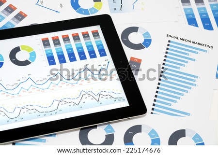 Social Media Marketing. Business charts and diagrams on digital tablet.