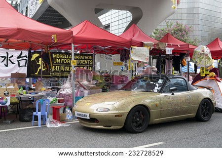 HONG KONG - NOV 11, 2014:A graffiti decorated car  at `Occupy Central` at the Admiralty. Occupy Central is a civil disobedience movement which began in Hong Kong on September 28, 2014.