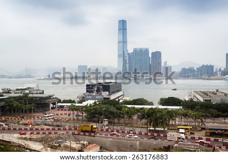 Hong Kong, Hong Kong SAR -November 12, 2014: Building site and the Central Piers area in Hong Kong. ICC and another high rise buildings at the opposite side of the Victoria Bay.
