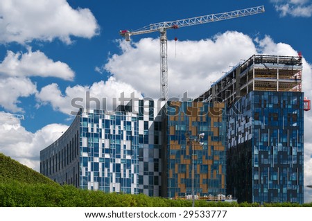 Construction of modern office buildings in green belt  in London.
