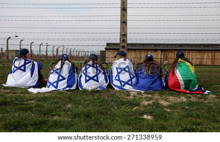 OSWIECIM, POLAND - APRIL 16, 2015: Holocaust Remembrance Day next generation of people from the all the world meets on the March of the Living in  German death camp in Auschwitz Birkenau, in  Poland