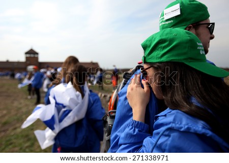 OSWIECIM, POLAND - APRIL 16, 2015: Holocaust Remembrance Day next generation of people from the all the world meets on the March of the Living in   German death camp in Auschwitz Birkenau, in  Poland