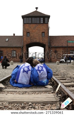 OSWIECIM, POLAND - APRIL 16, 2015: Holocaust Remembrance Day next generation of people from the all the world meets on the March of the Living in   German death camp in Auschwitz Birkenau, in Poland