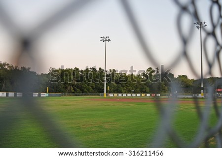 Seeing through chain link for a light post at a baseball field