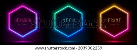 Set of pink-blue, red-purple, green illuminate hexagon frame design. Abstract cosmic vibrant color geometric backdrop. Collection of glowing neon lighting on dark background with copy space. Top view.