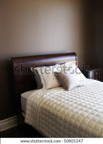 pillows on the bed in the brown bedroom