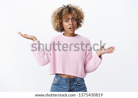 Yo watch your mouth. Portrait of insulted pissed african-american woman with blond haircut raising hands sideways in dismay shocked and offended posing confused over white background, angry Сток-фото © 