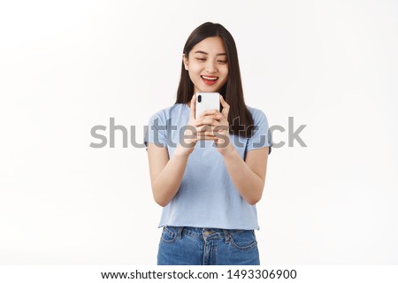 Similar – Image, Stock Photo Delighted teen woman taking selfie on smartphone