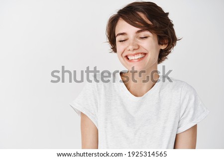 Similar – Image, Stock Photo Young woman with eyes closed standing near wall