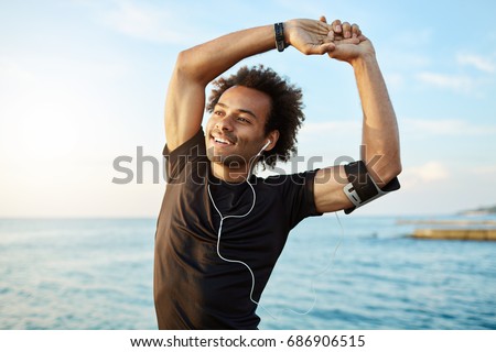 Similar – Image, Stock Photo Afro and black man with sunglasses working with his laptop on th