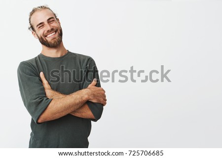 Similar – Image, Stock Photo Stylish attractive guy with dreadlocks is recording a song in the studio. A young singer in black studio headphones stands in front of a microphone in the blurred background. Low key lighting.