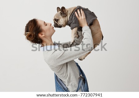 Similar – Image, Stock Photo Caucasian woman holding puppy. Adopted border collie dog held by a caucasian woman with long blond hair. Friendship and family.