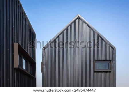 Similar – Image, Stock Photo House with metal facade in front of a blue sky with light veil clouds