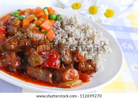 Pork stew with pearl barley and vegetables