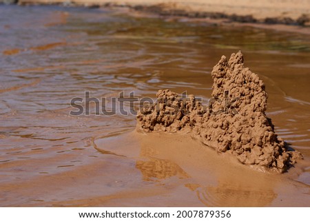 sand castle on the beach near the water. High quality photo Foto d'archivio © 