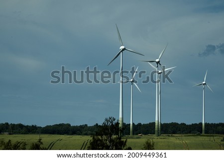 Power of wind turbine generating electricity clean energy with cloud background on the sky.Global ecology.Clean energy concept save the world. High quality photo