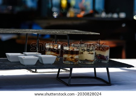Black buffet table with beautiful decorated dishes. Breakfast at hotel. Catering. Decoration for a Banquet. High quality photo Stok fotoğraf © 