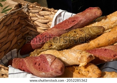 a wicker basket filled with fresh baguettes stands on a table at a fair in europe. High quality photo Stok fotoğraf © 