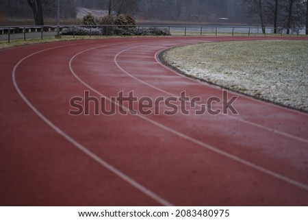 Red treadmill on sport field. Running track on the stadium Stock foto © 