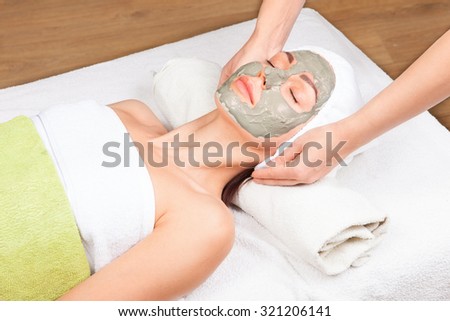 Young attractive woman getting treatment  in the spa salon