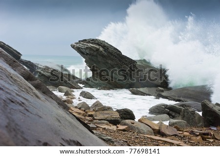 storm waves rolled on rocky shore