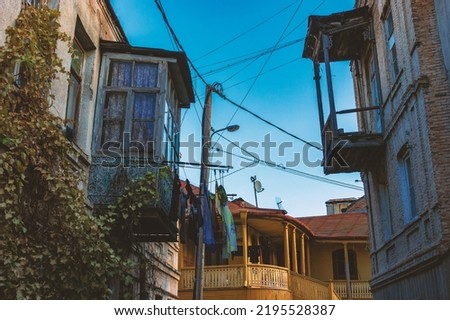 Similar – Image, Stock Photo Courtyard of an old house with a cloud