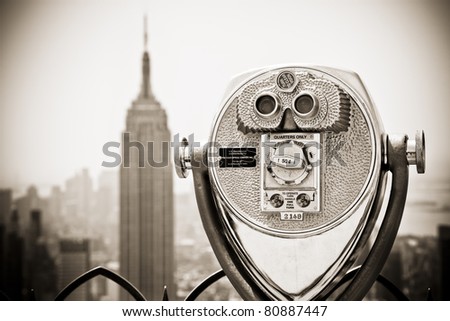 Binoculars looking down to the Empire State building. The image is converted to sepia to add some extra expression.