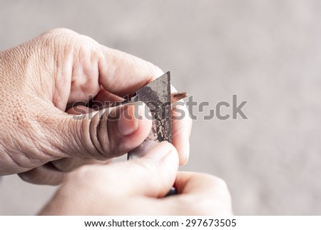 handing pencil sharped by cutter knife