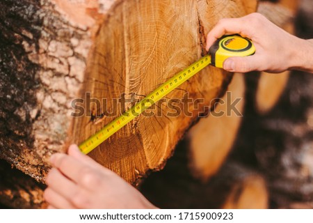 Similar – Image, Stock Photo Skilled woodworker using milling machine while working with lumber in contemporary workroom