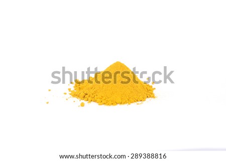 Pile of ground turmeric in the centre of a white background