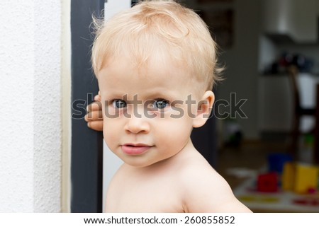 Similar – Image, Stock Photo Portrait through balcony door of young blonde woman in dress and stockings