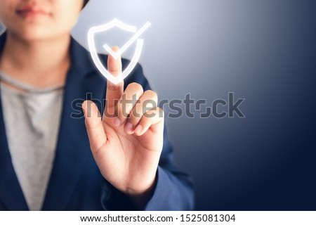 Certified Guarantee Approval or Secure Access System Concept, Business Woman is Pressing Identity Proofing Icon for Security Protection Systems on Screen. Business Financial Warranty for Investment  Foto d'archivio © 
