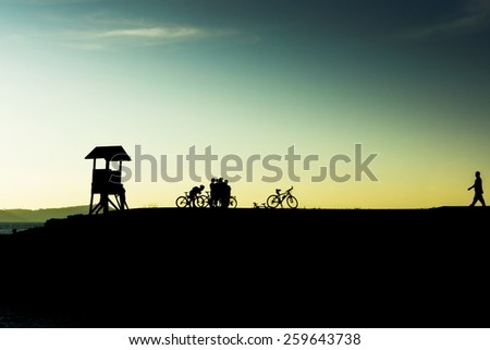 Outdoor mountain bike  - cyclists silhouettes on the background.(I)