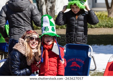 Greenwich, CT, USA - March 22nd, 2015: Spectators enjoying the  